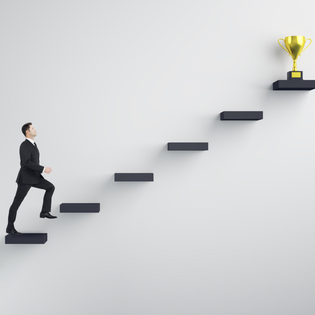 Man climbing the stairs to a trophy