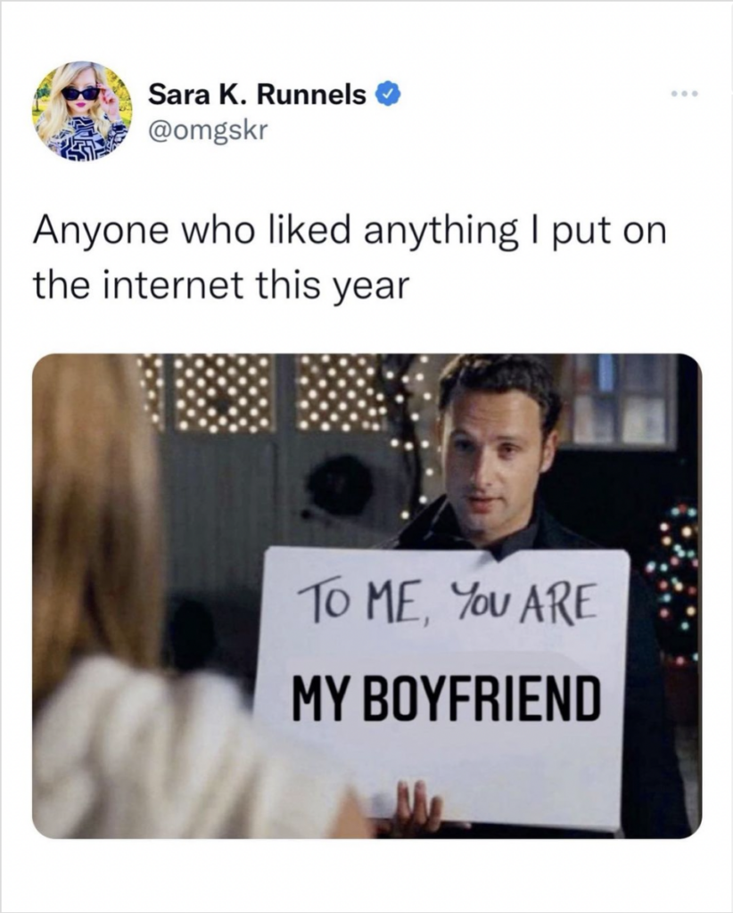 man holding sign Love Actually