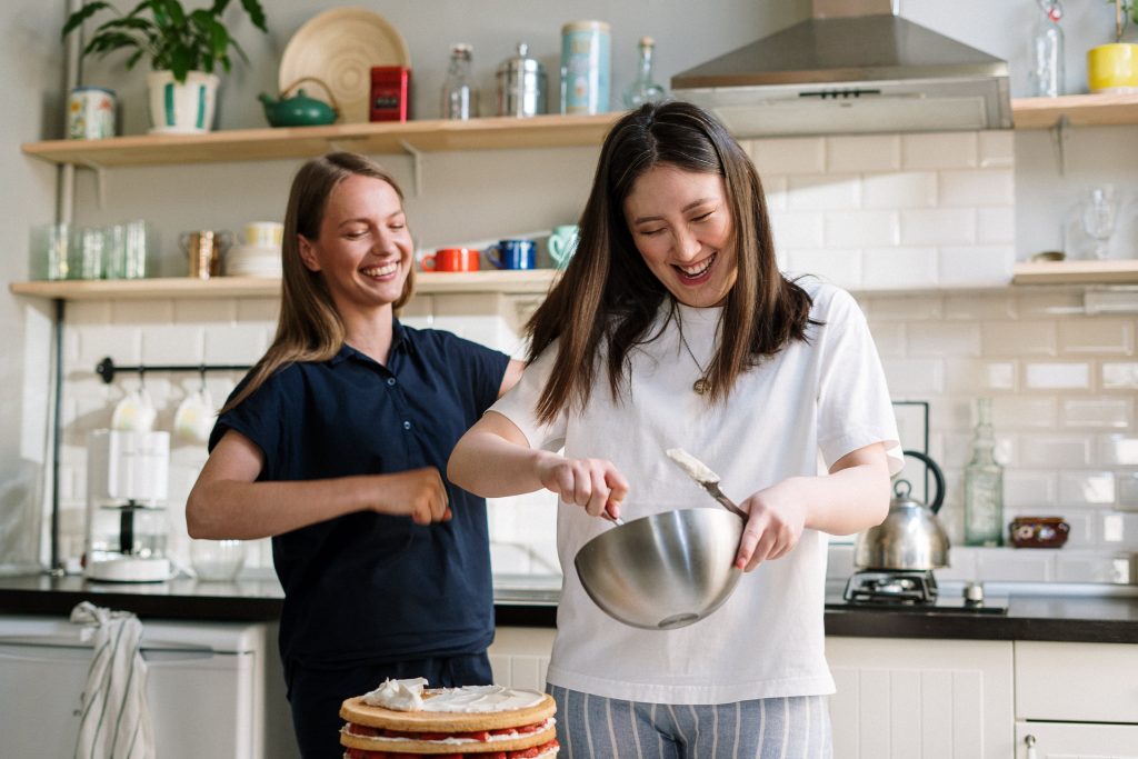 Woman cooking with friend