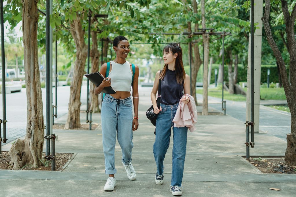 two female friends walking and talking